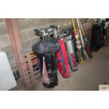 Three golf bags and contents