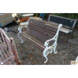 A cast iron and wooden garden bench