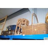 A wicker stool and two wicker baskets together wit
