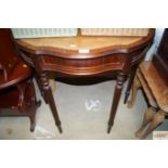 A reproduction mahogany demi lune hall table with