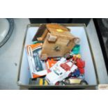A box containing various diecast vehicles to inclu