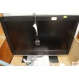 A Sony flat screen TV with remote control