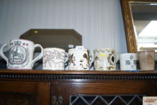 Three Wedgwood commemorative mugs designed by Rich