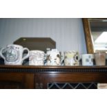 Three Wedgwood commemorative mugs designed by Rich