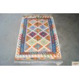 An approx.4'1" x 2'6" Chobi Kelim rug