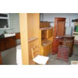 A teak effect sideboard and matching bookcase