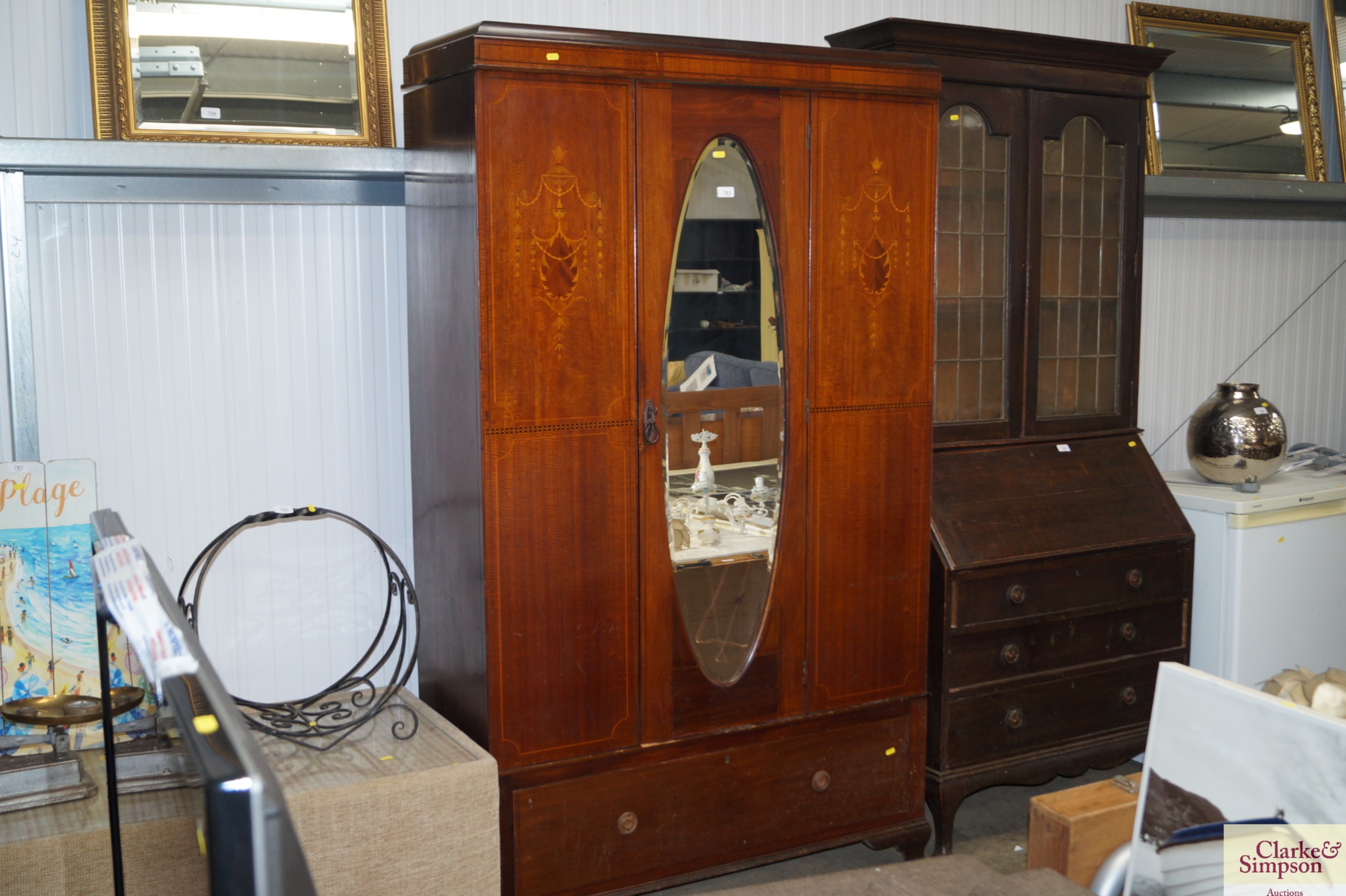 An Edwardian mirror fronted single drawer wardrobe