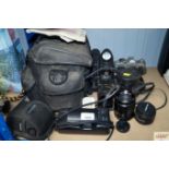 A Cannon camera, various lenses, carry bag, camcor