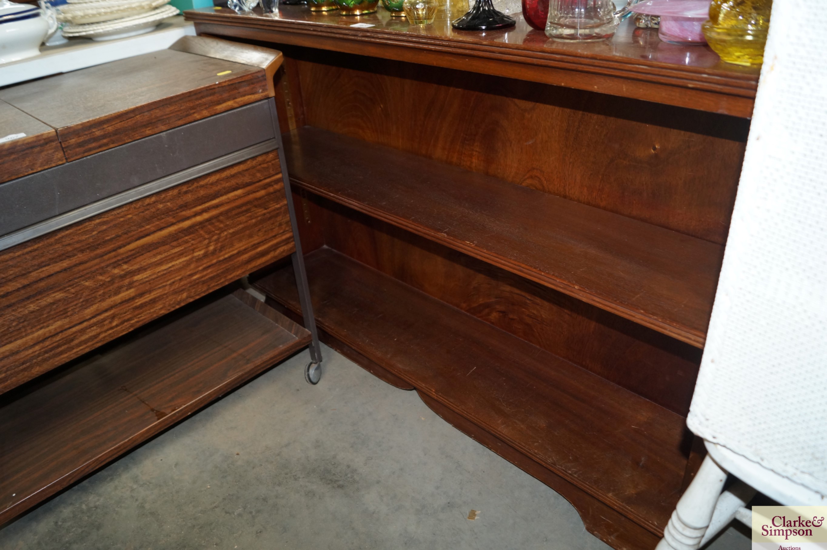 A mahogany open fronted bookcase