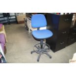 A blue upholstered swivel upholstered office chair