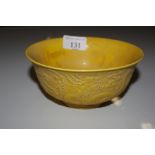 A Chinese yellow glazed bowl with dragon decoratio