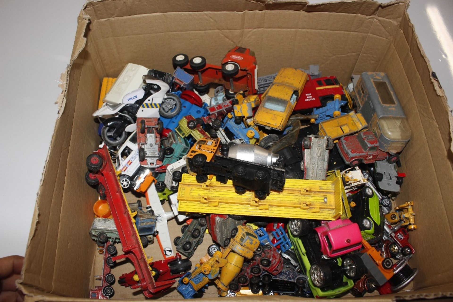 A collection of various die-cast toys to include D