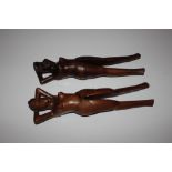 Two treen nut crackers in the form of naked lady's