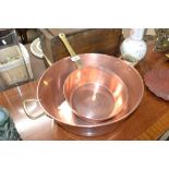 A brass and copper preserve pan and a heavy brass
