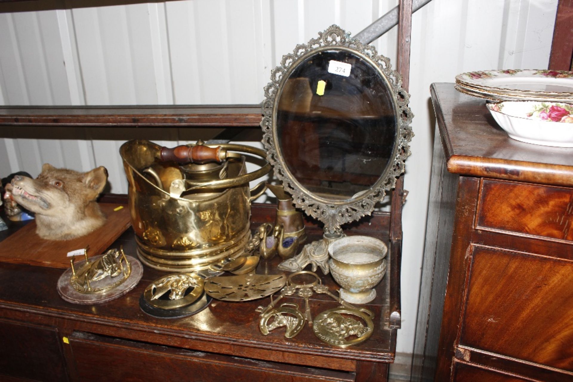 A collection of various brassware including a tabl