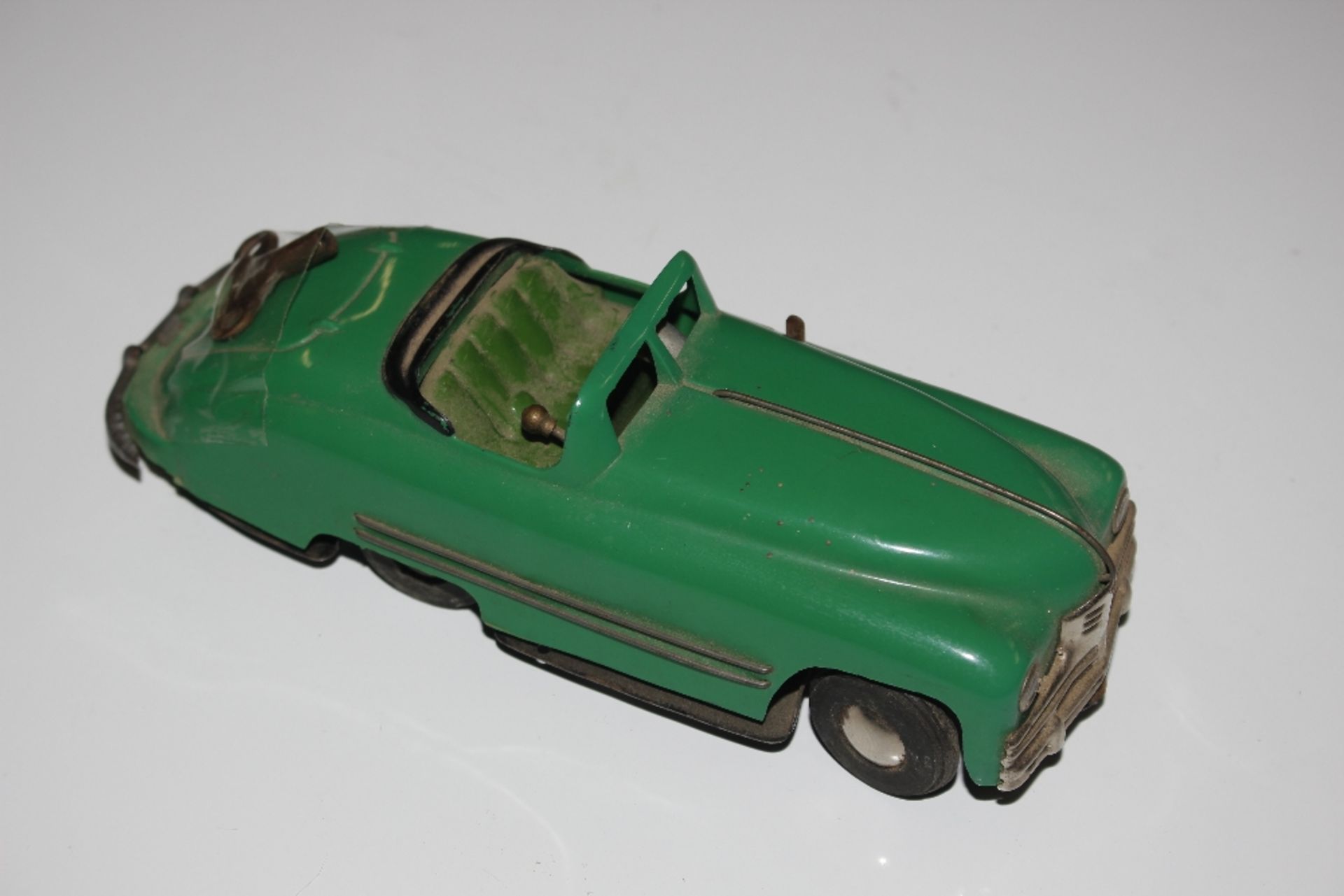 A vintage clockwork toy car