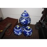 A pair of blue and white ginger jars, and one othe