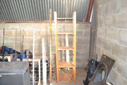 A four tier wooden shelving unit