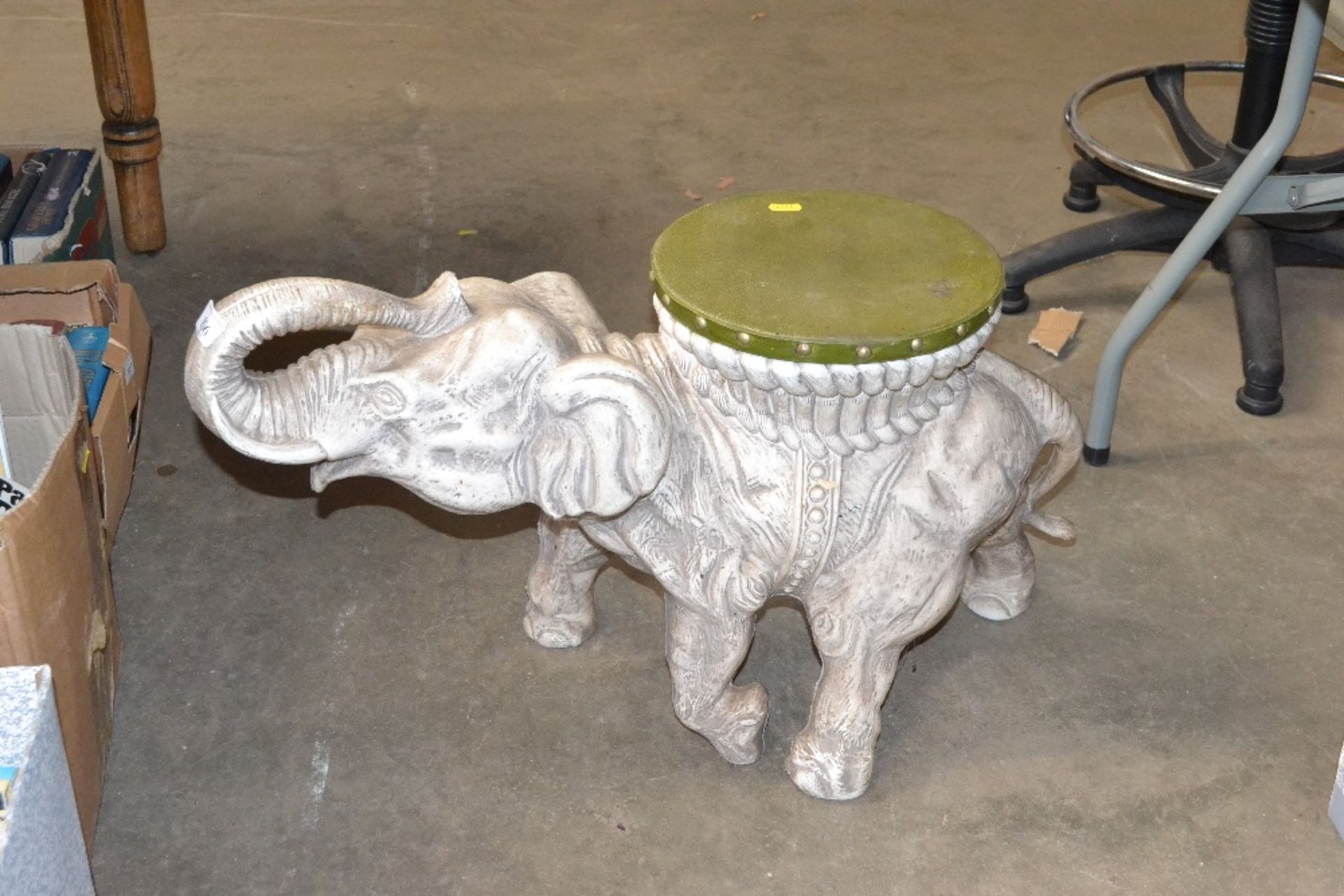 A plastic elephant seat