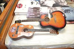 A Westville acoustic guitar and another acoustic g