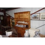 A large pine kitchen dresser fitted four central d