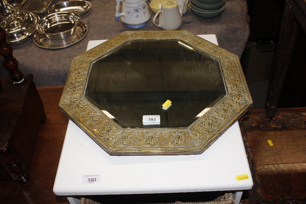 An octagonal bevel edged wall mirror contained in