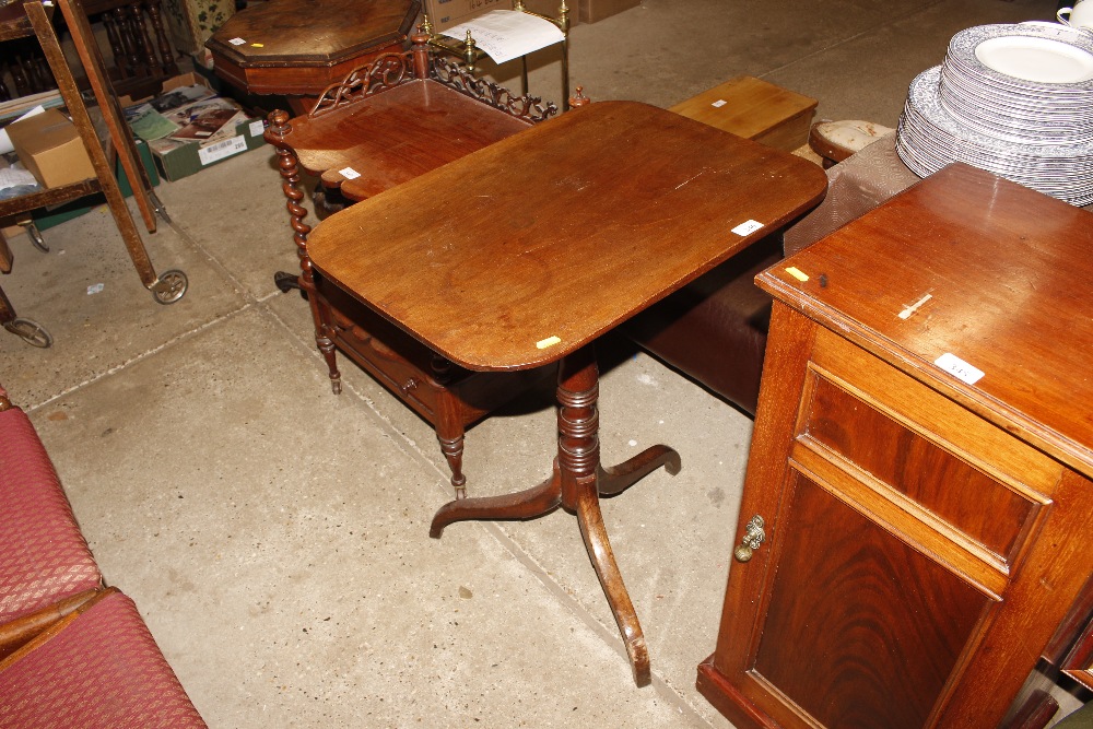 A 19th Century side table raised on turned tripod