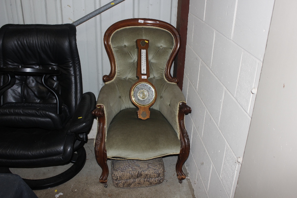 A Victorian mahogany spoon back armchair