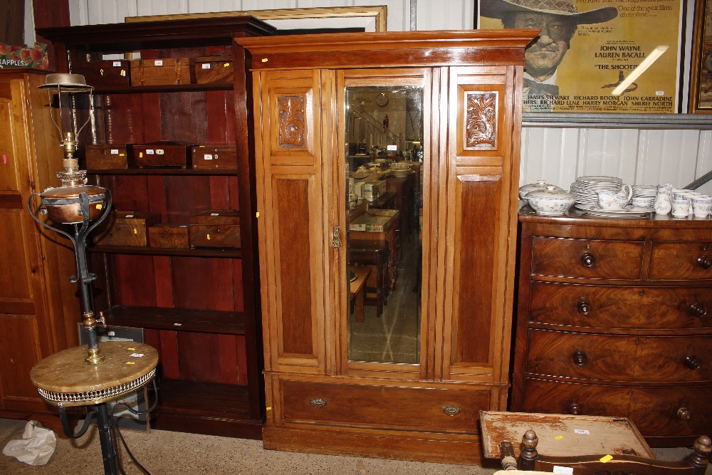 An Edwardian satinwood wardrobe