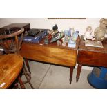 A 19th Century mahogany Pembroke table raised on t