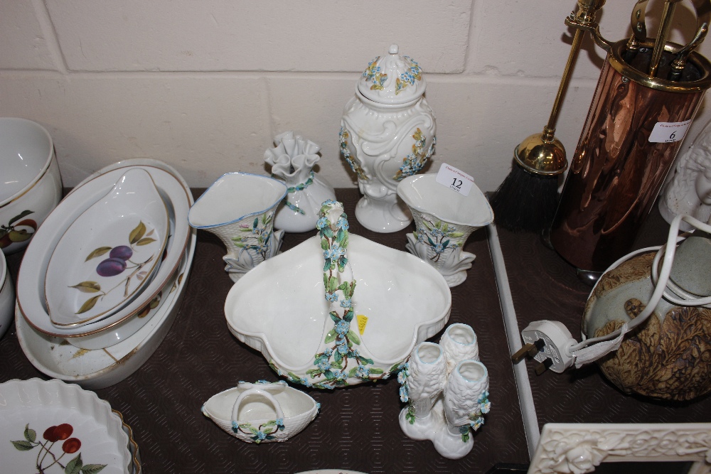 A porcelain floral encrusted post basket; a smalle
