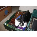 A box containing miscellaneous binoculars, cameras