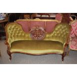 A Victorian ornate carved walnut chaise longue uph
