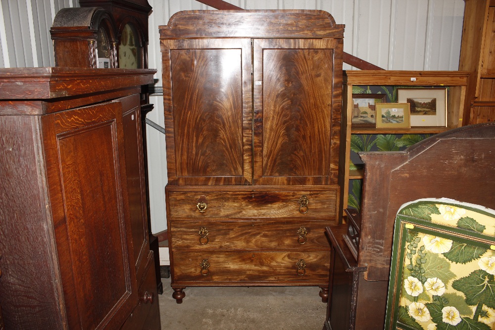 A George III mahogany linen press fitted three sli