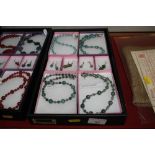 A box of various hand made jewellery to include tu
