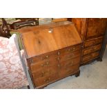 An 18th Century walnut bureau, the fall front open