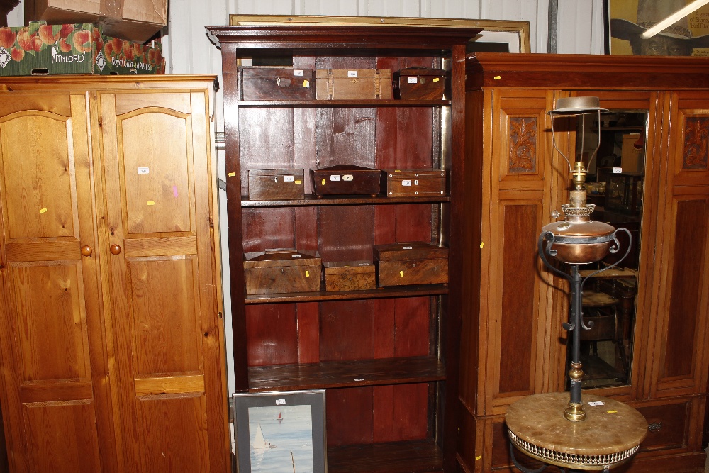 A reproduction open fronted bookcase