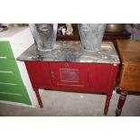 A red painted and marble topped washstand AF