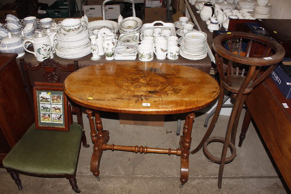 A 19th Century walnut oval topped side table with