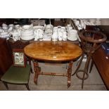 A 19th Century walnut oval topped side table with