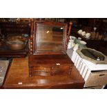 A 19th Century mahogany swing framed mirror raised