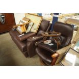 A brown leather upholstered reclining two seater s