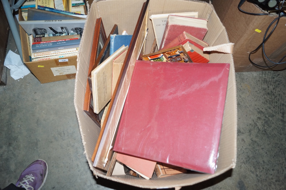 A box of various books, picture frames and prints