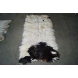 An approx. 4'6" x 2'6" skin rug