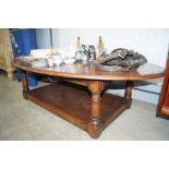 A good quality reproduction oak oval coffee table
