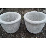 A pair of concrete garden planters