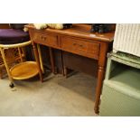 An oak hall table, fitted two drawers