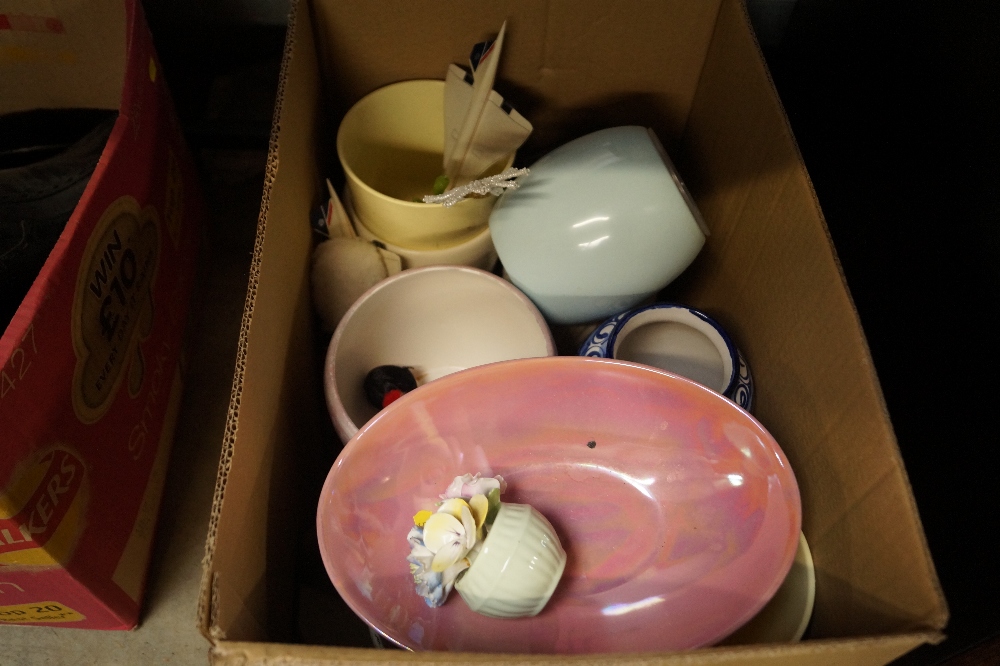 A box containing various vases and jardinieres