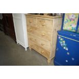 A stripped pine chest fitted two short over three