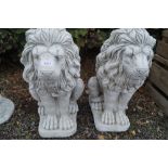 Two garden ornaments in the form of lions